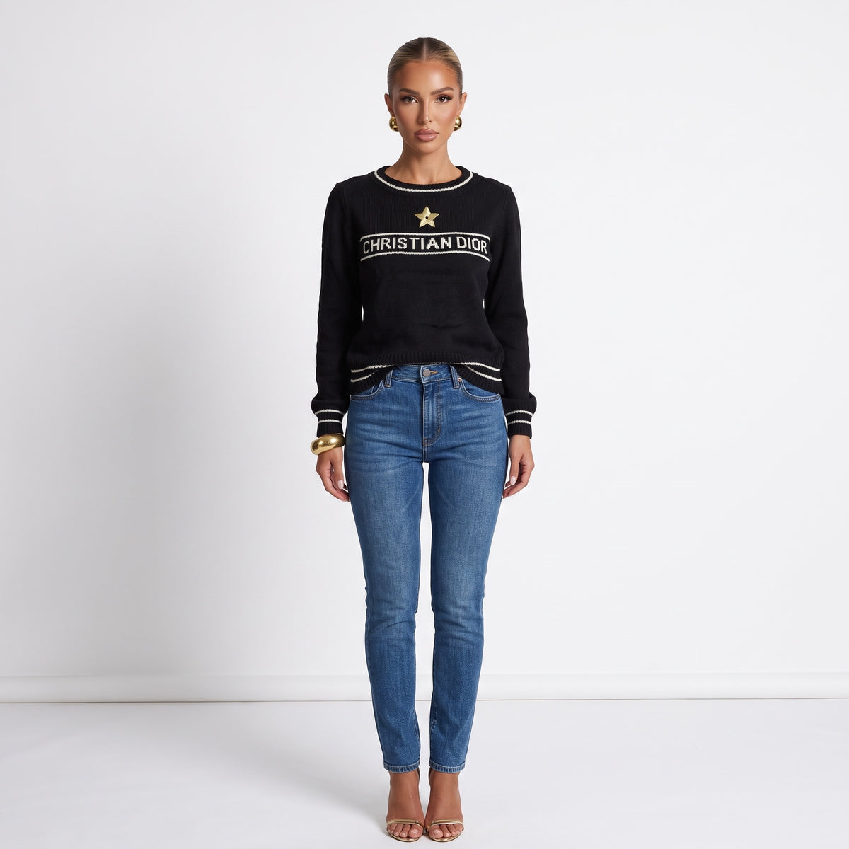 Black Christian Dior knit sweater with white trim and gold star applique