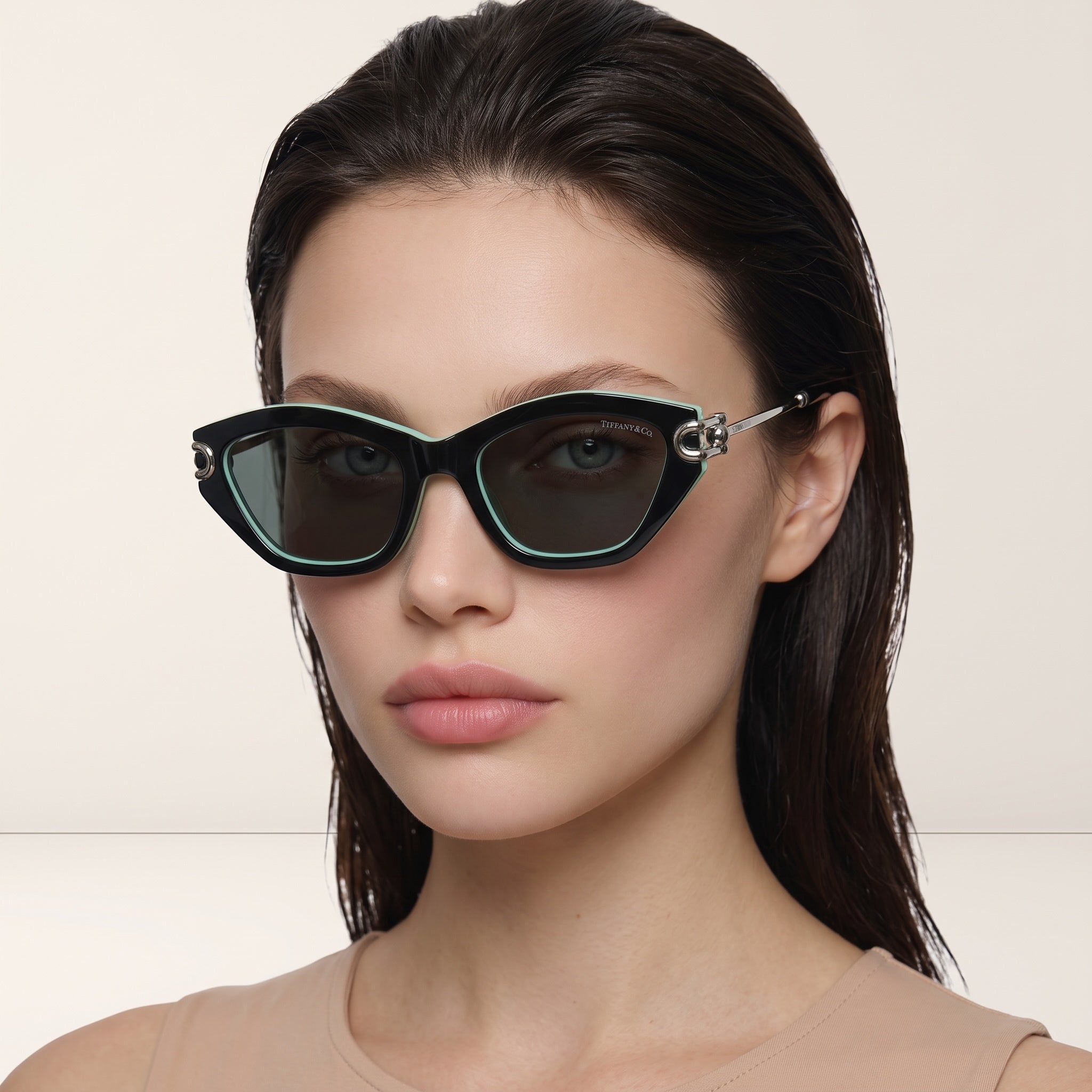 Tiffany & Co. black cat‑eye sunglasses with mint trim and silver temple detail