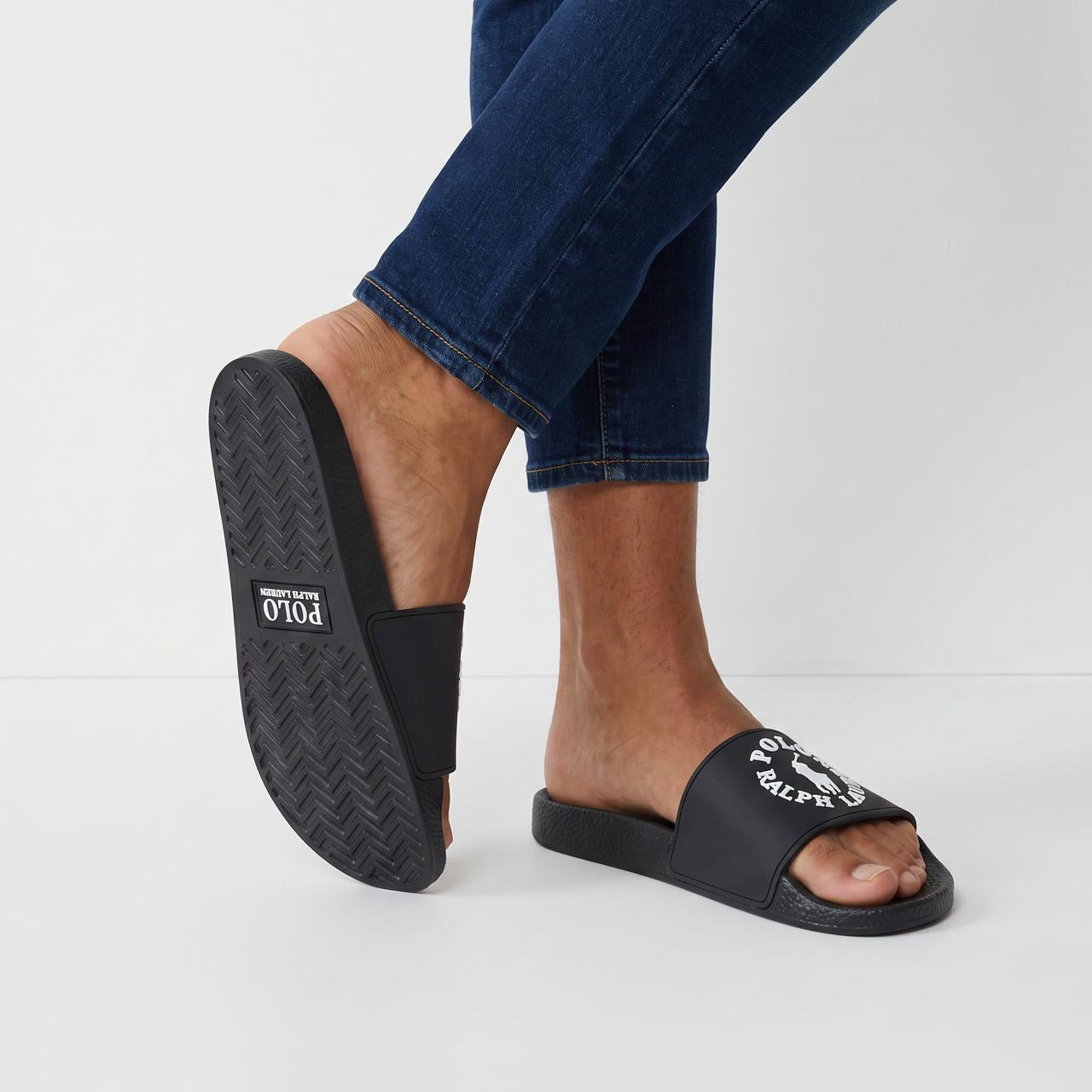 Black Polo Ralph Lauren slides with white circular logo on wide strap