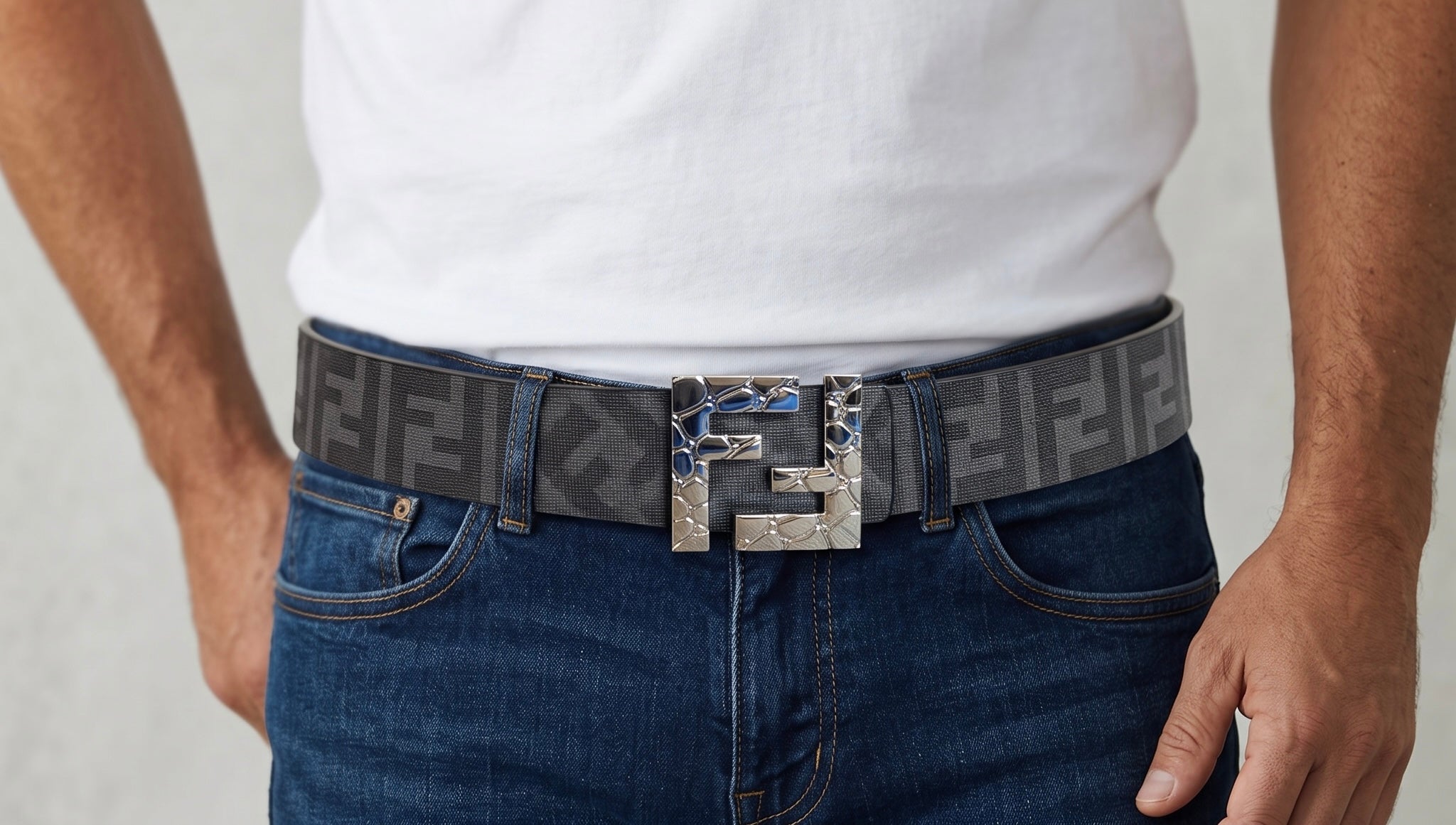 Fendi grey monogram belt with silver double F buckle on jeans