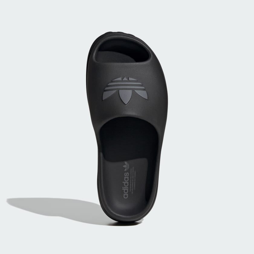black adidas platform slide sandal with embossed trefoil