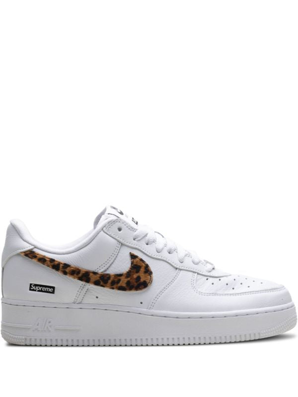 White Nike Air Force 1 Low sneaker with leopard-pattern Swoosh and Supreme box logo