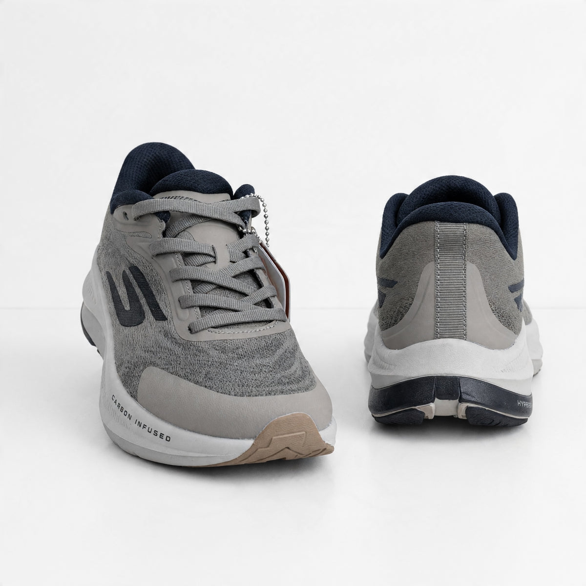 pair of grey Skechers trainers with carbon-infused midsole