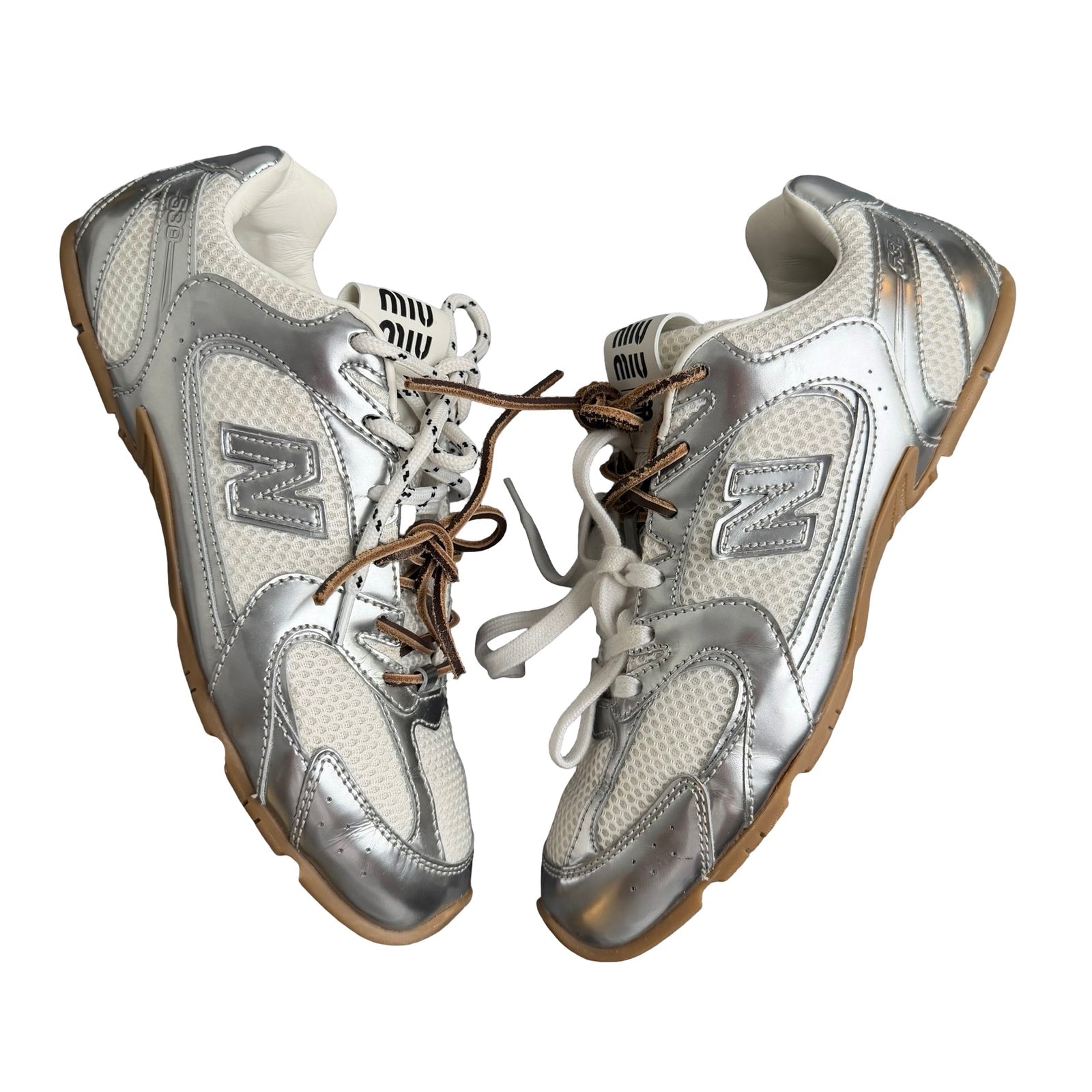 New Balance 328 silver and white trainer with gum sole and mesh upper