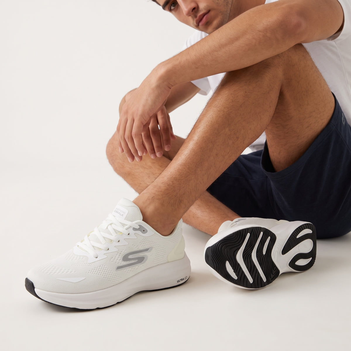 White Skechers Go Walk Ultra knit trainers with black outsole