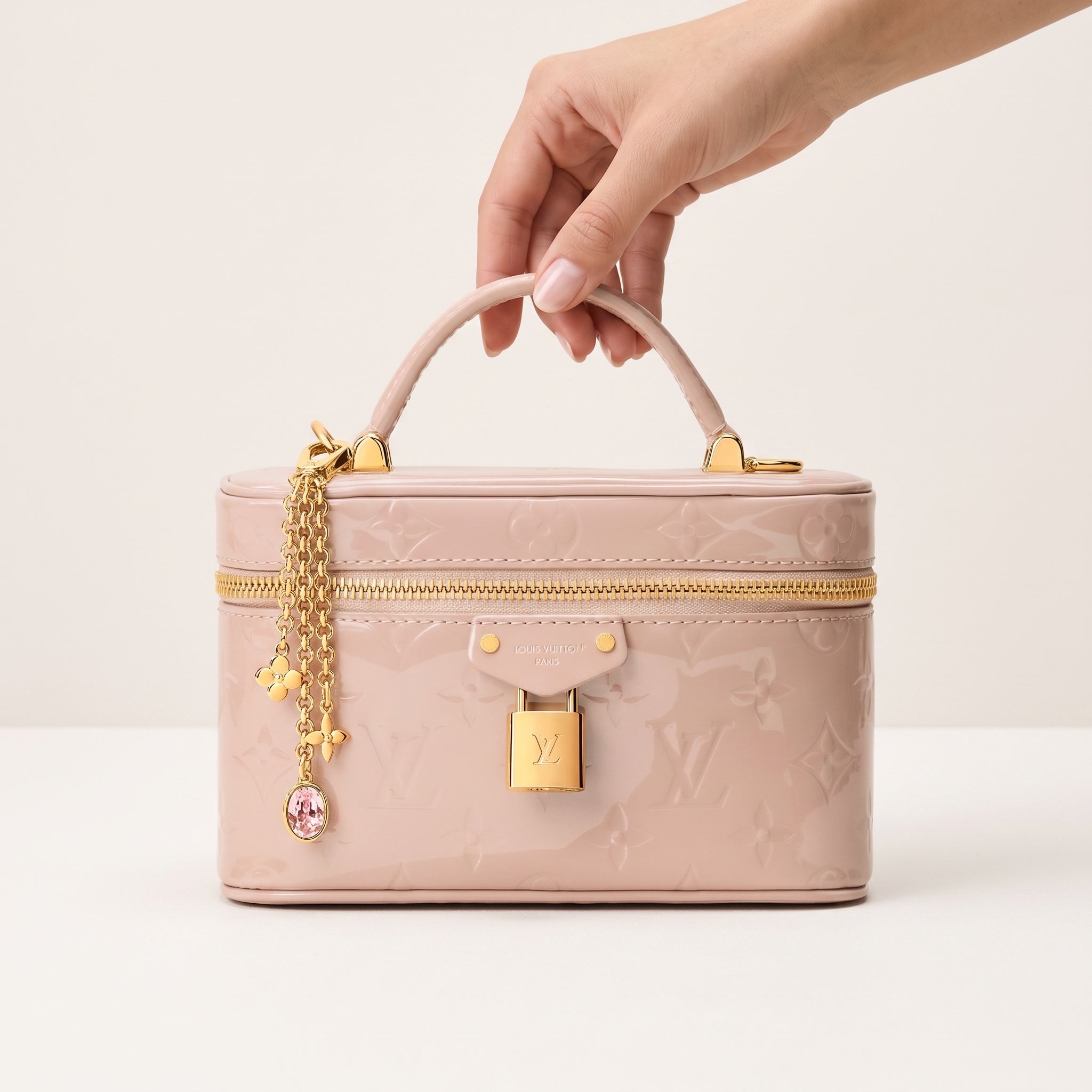 Louis Vuitton pale pink patent monogram vanity bag with top handle and gold lock