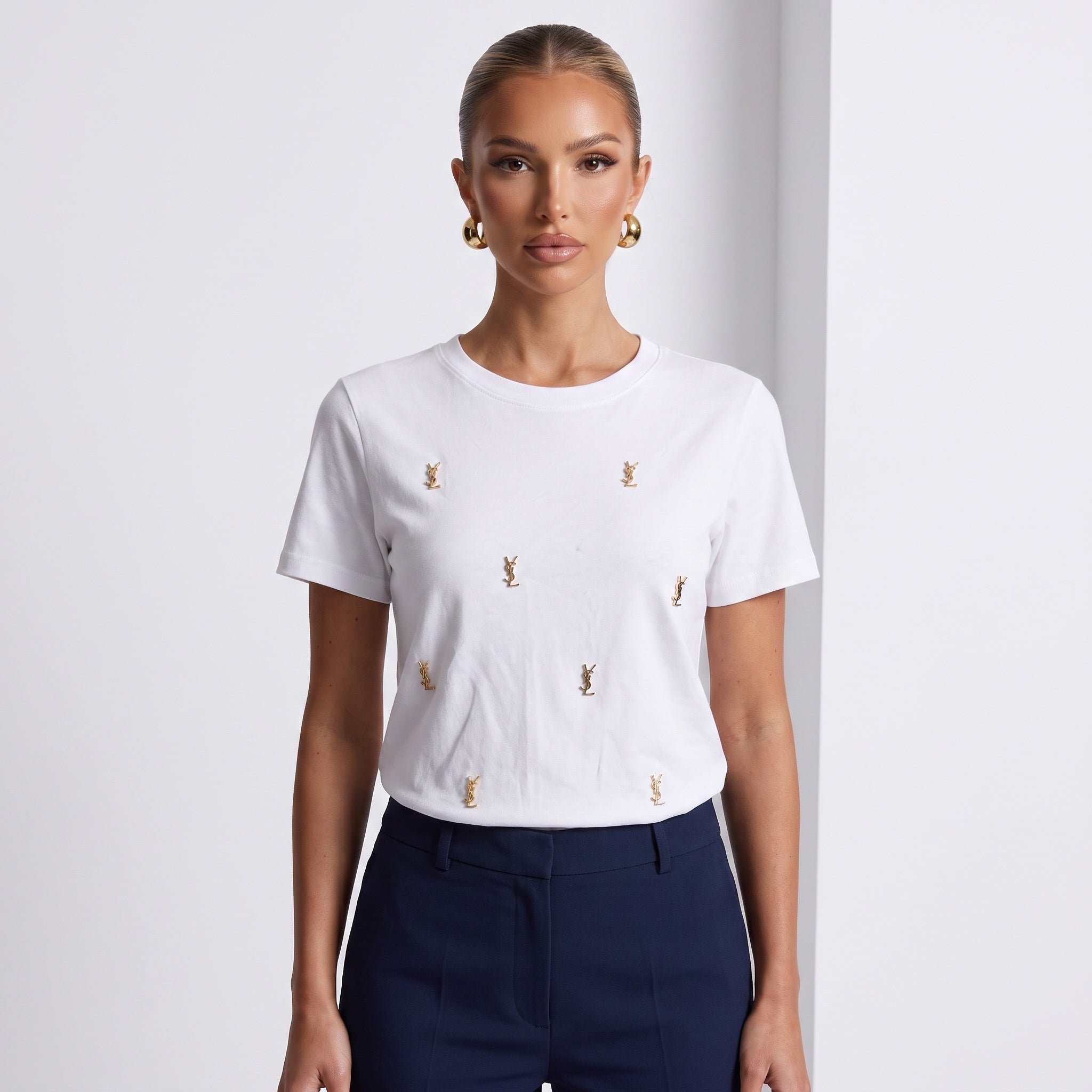 White Saint Laurent T-shirt with multiple small gold YSL logo studs on the front