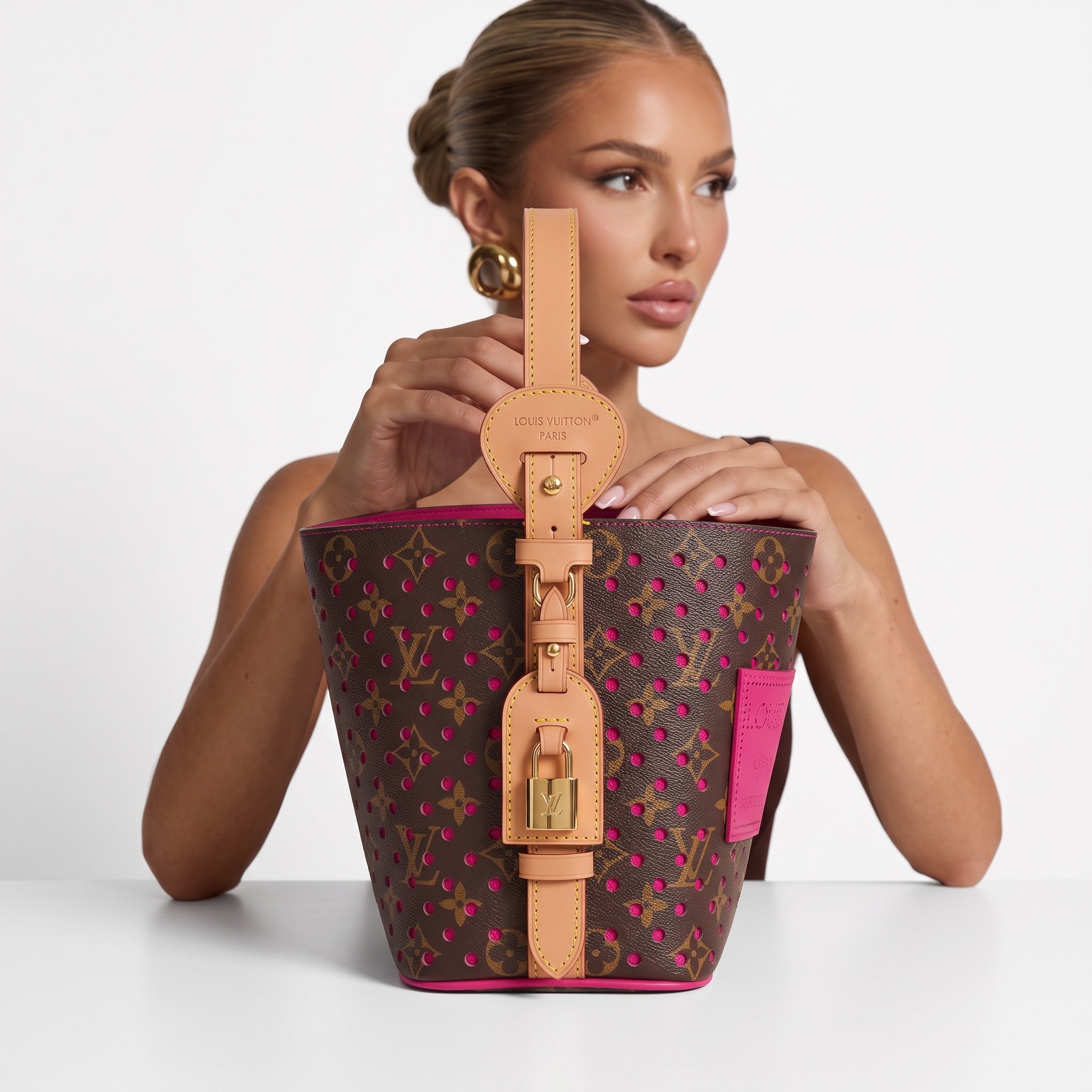 Louis Vuitton brown monogram bucket bag with pink perforations and natural leather handle