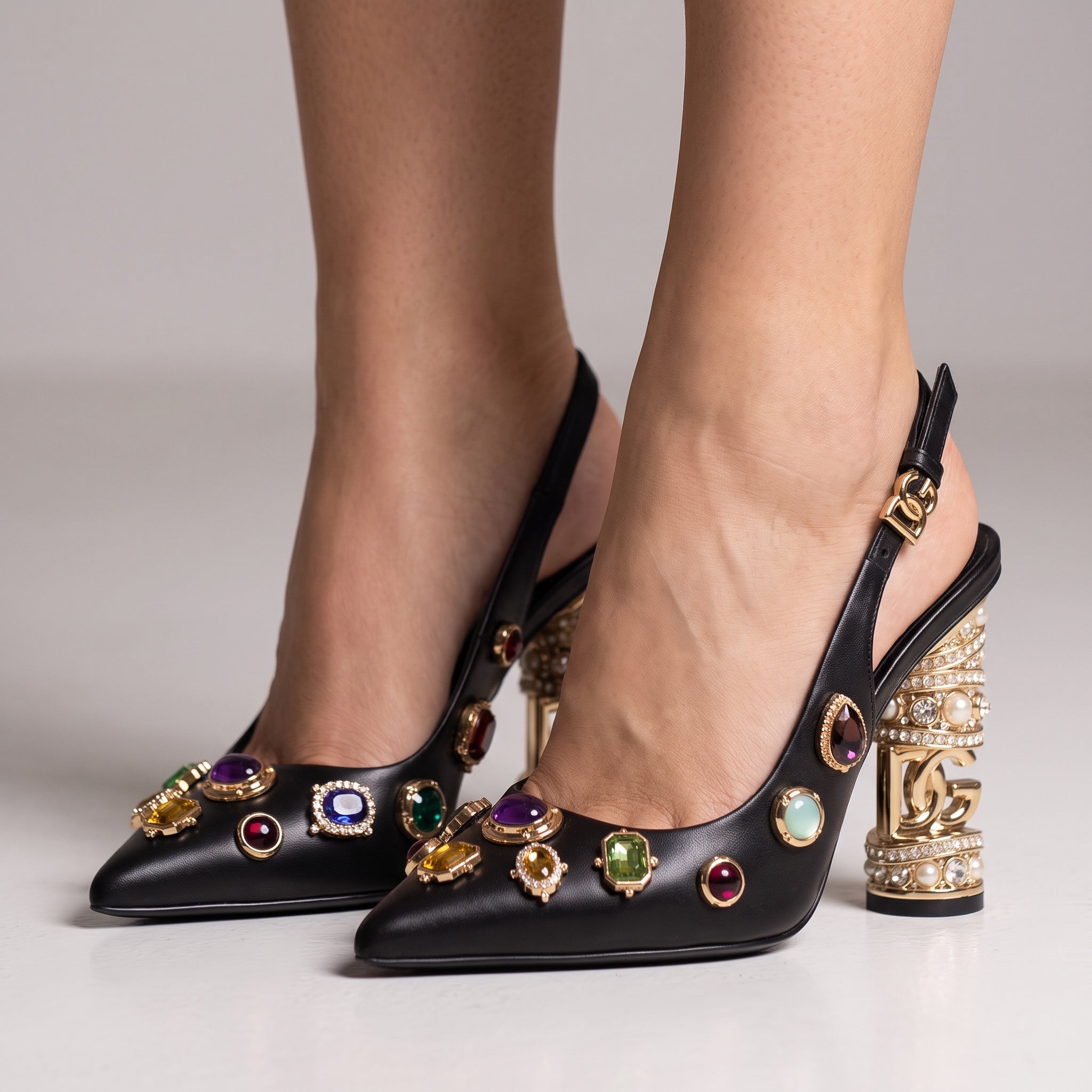Black slingback pumps with multicolour jewel studs and ornate gold-tone sculptural heel
