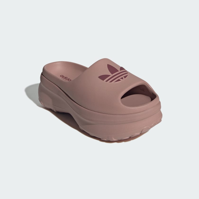 blush pink Adidas platform slide with embossed trefoil logo