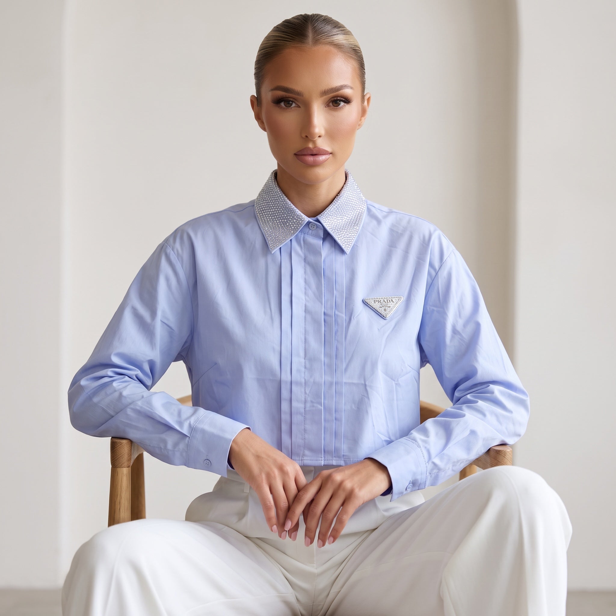 Prada light blue cropped shirt with crystal‑embellished collar and Prada triangle patch