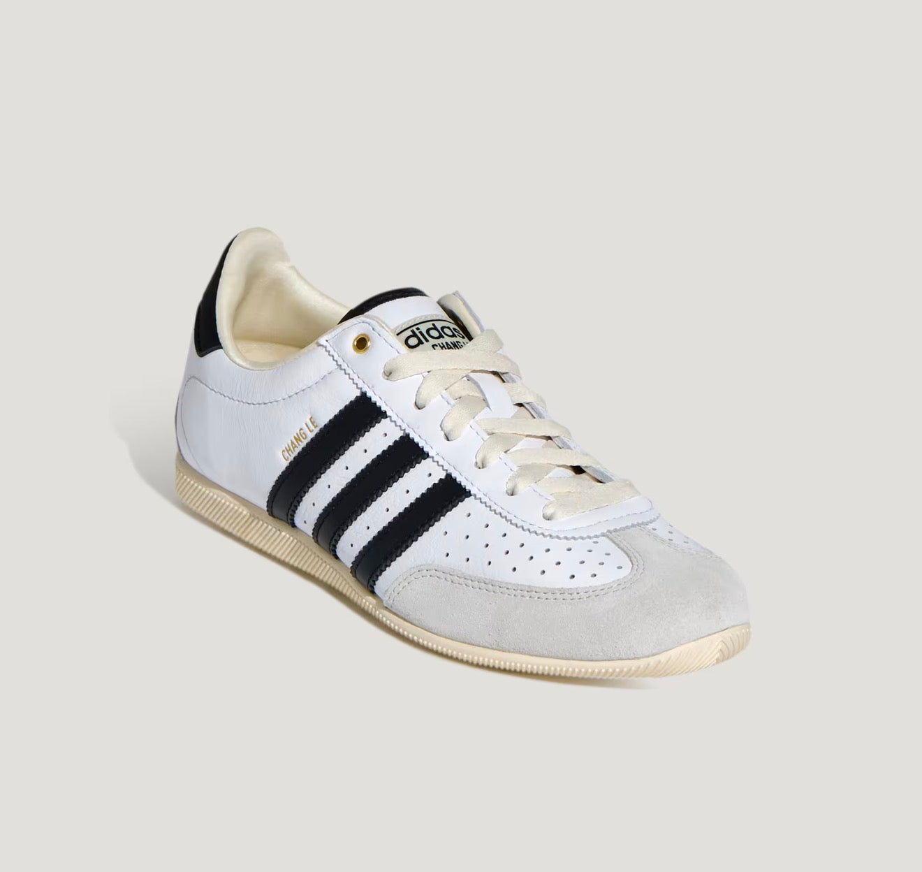 Adidas Chang Le white trainer with black stripes and pale grey suede toe