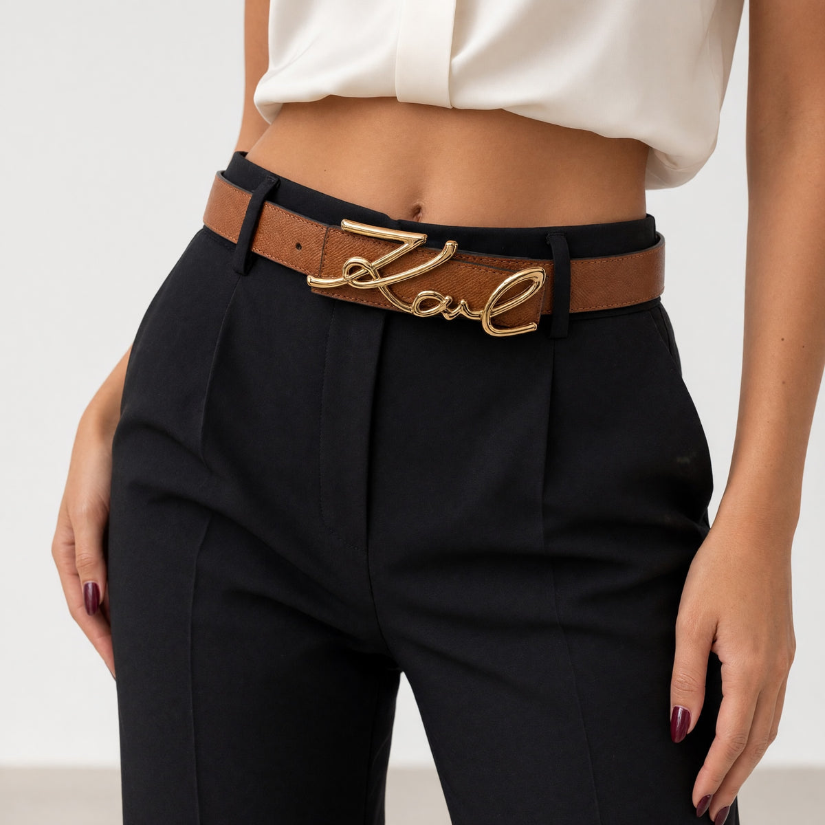 Brown belt with large gold script Karl logo buckle