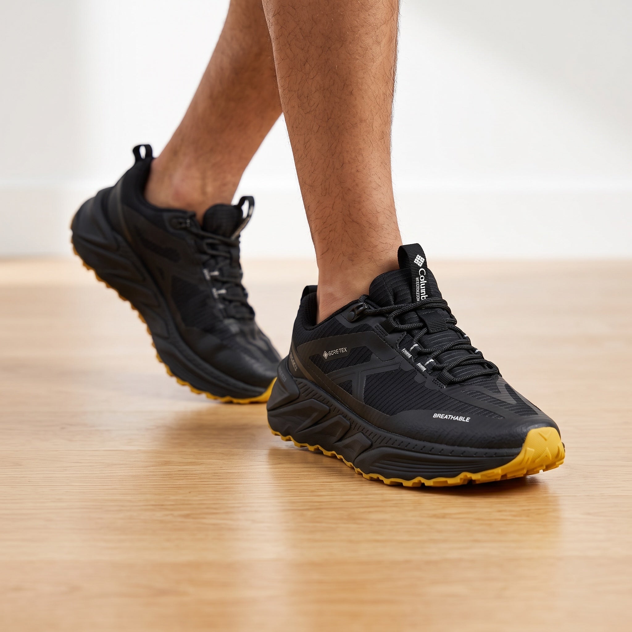 Columbia black trail sneaker with yellow lugged outsole and GORE-TEX branding