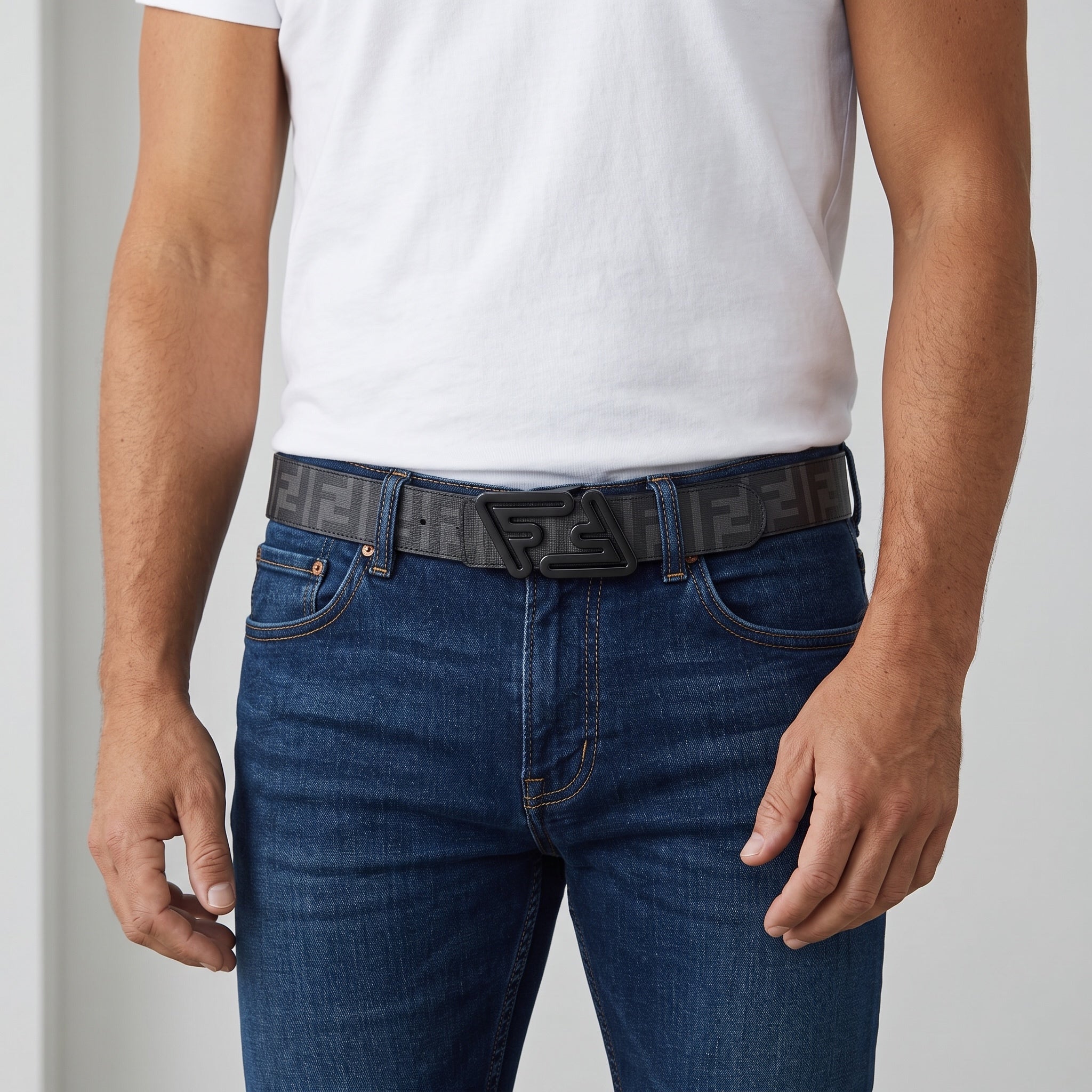 Grey Fendi Zucca patterned belt with black FF logo buckle worn with jeans
