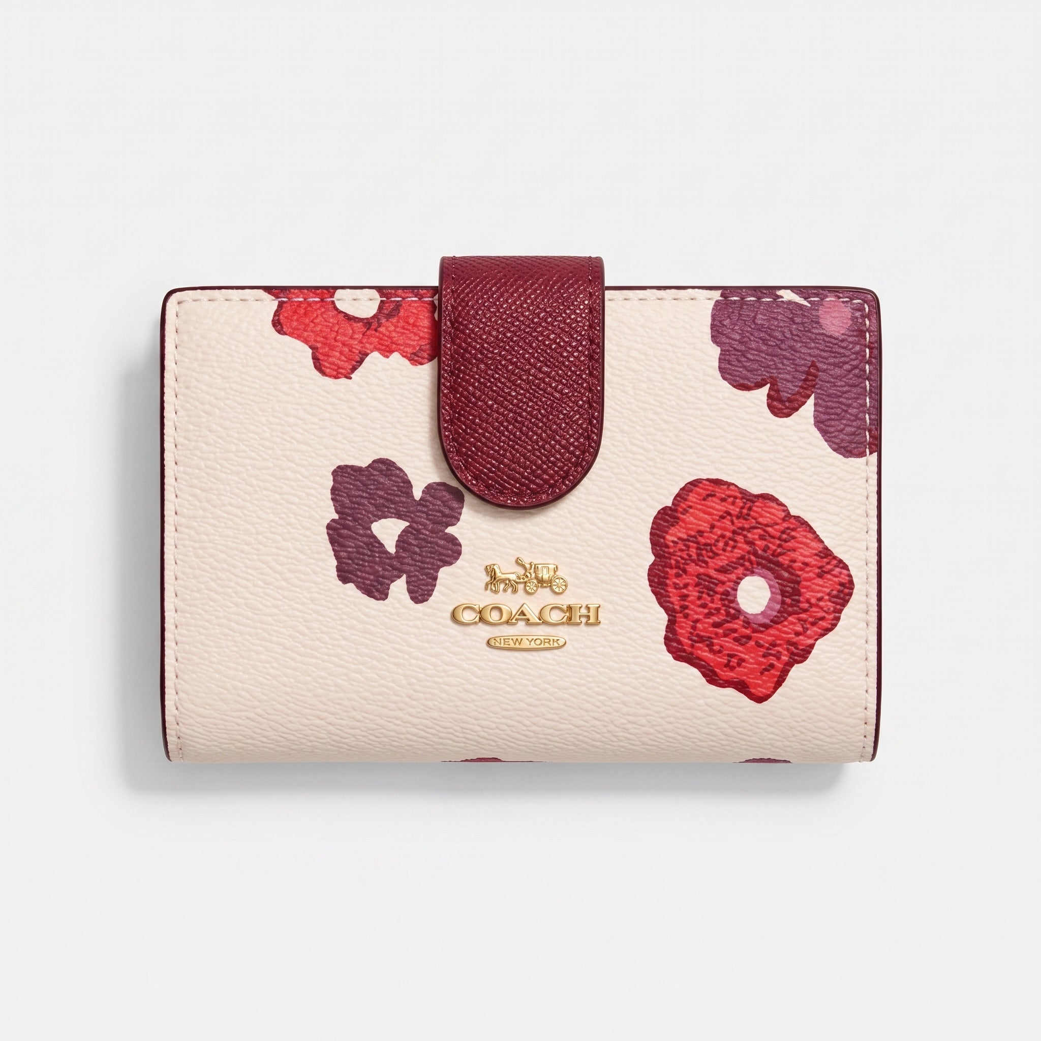 Coach small cream wallet with red and plum floral print, burgundy tab and gold logo