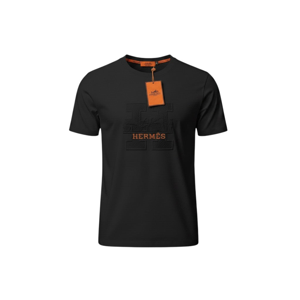 MASTERPIECE black cotton t-shirt with embossed Hermès H logo and orange tag detail. Crew neck, premium fit.