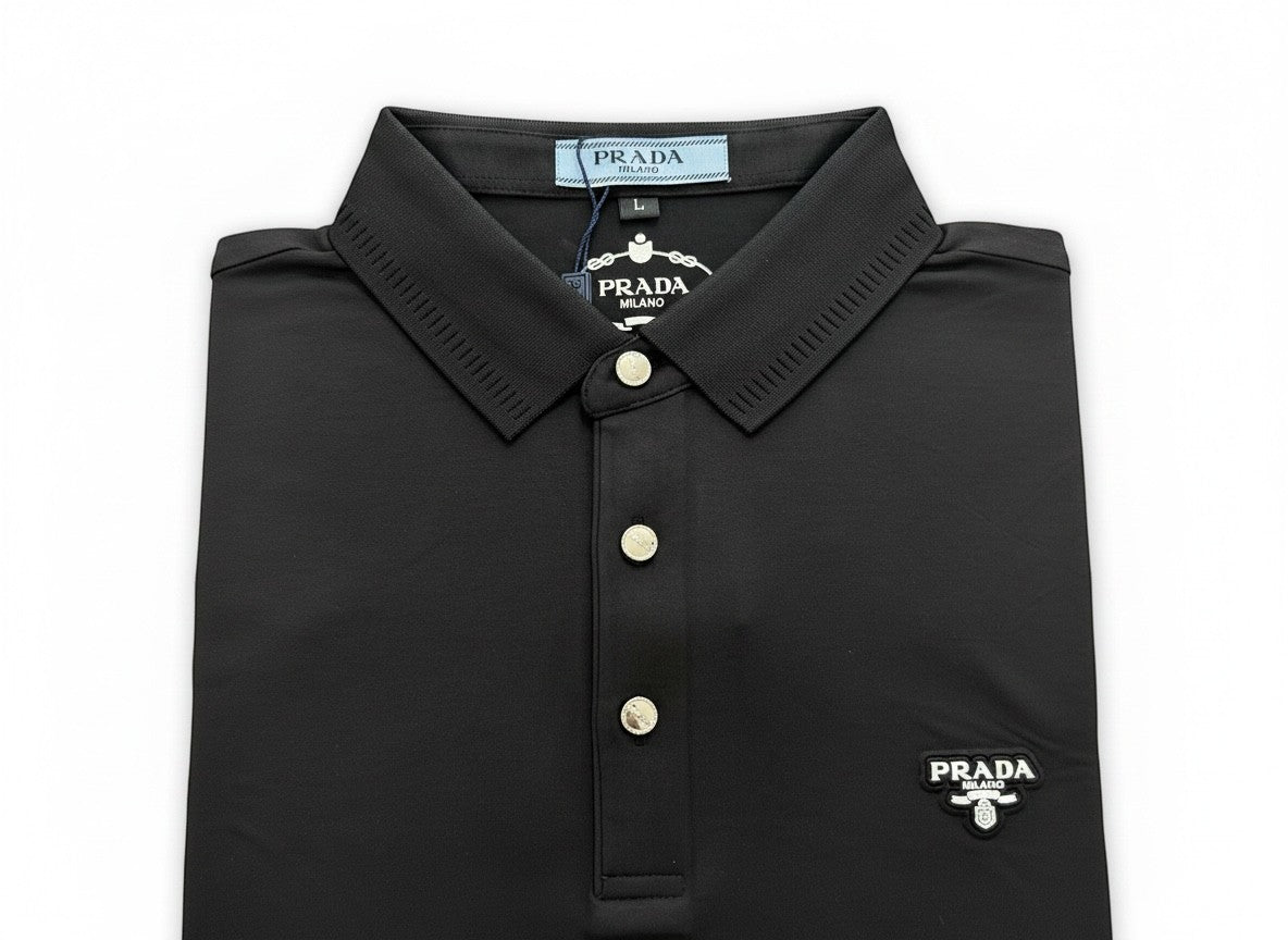 MASTERPIECE black Prada polo shirt with signature chest logo, classic collar, and button placket. Made from breathable stretch fabric.