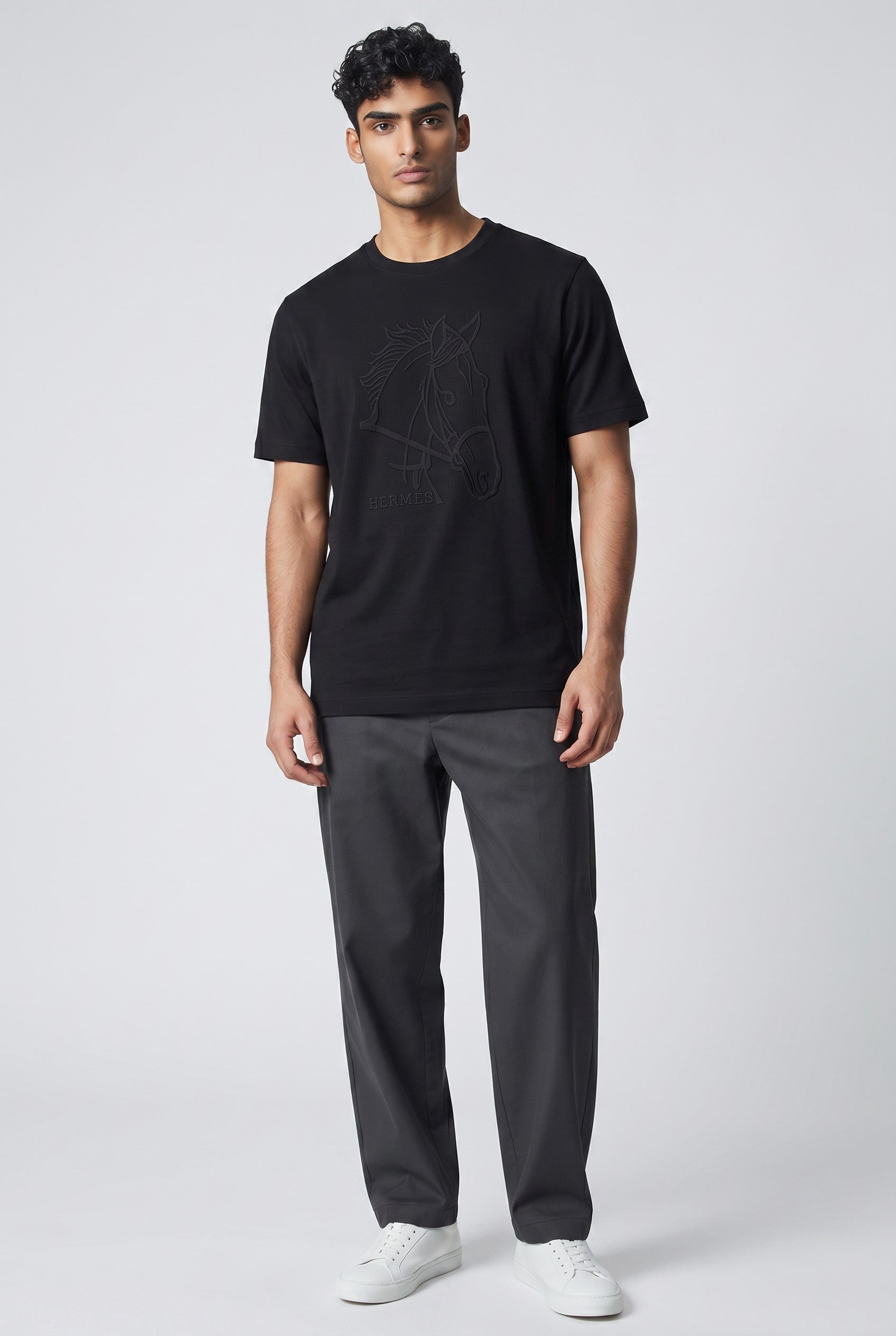 MASTERPIECE black t-shirt with tonal horse graphic and subtle Hermès branding. Premium smooth fabric, tailored fit.