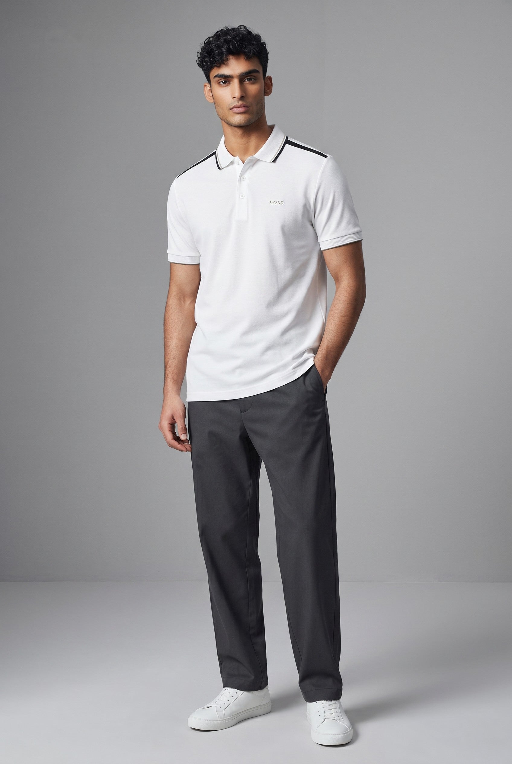 MASTERPIECE BOSS white polo shirt with black shoulder stripes and minimal chest logo. Breathable fabric, regular fit.