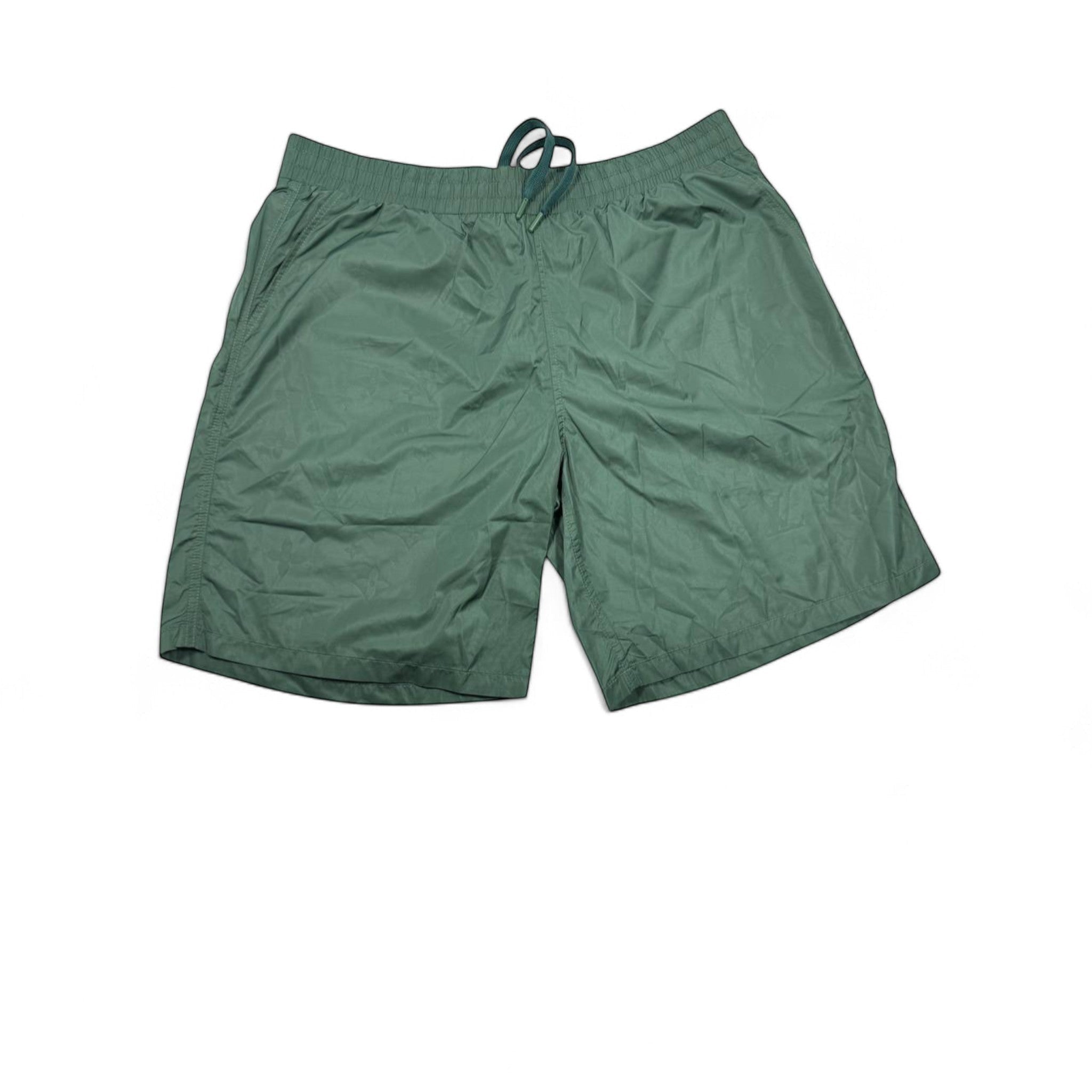 MASTERPIECE green technical fabric swim shorts with tonal monogram pattern and drawstring waist.