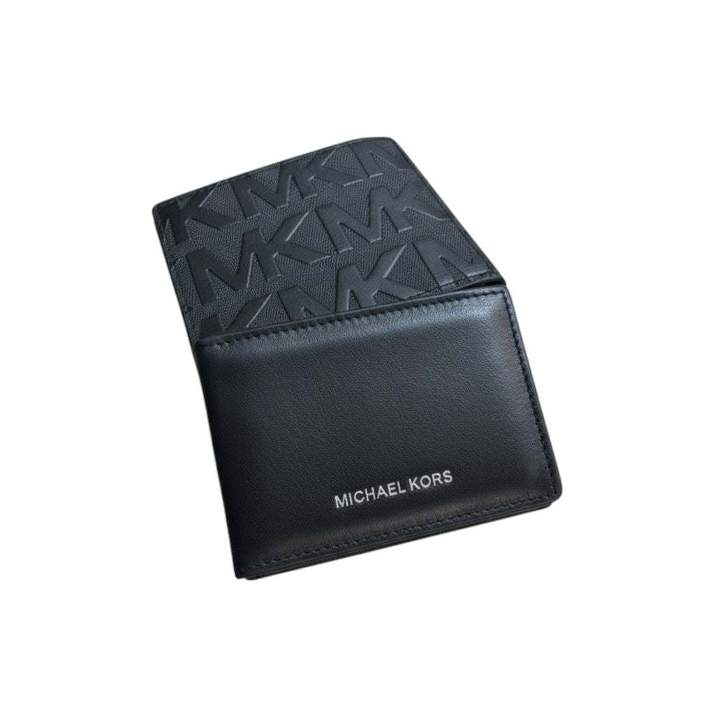 MASTERPIECE Michael Kors black leather bifold wallet with MK monogram pattern and embossed logo.