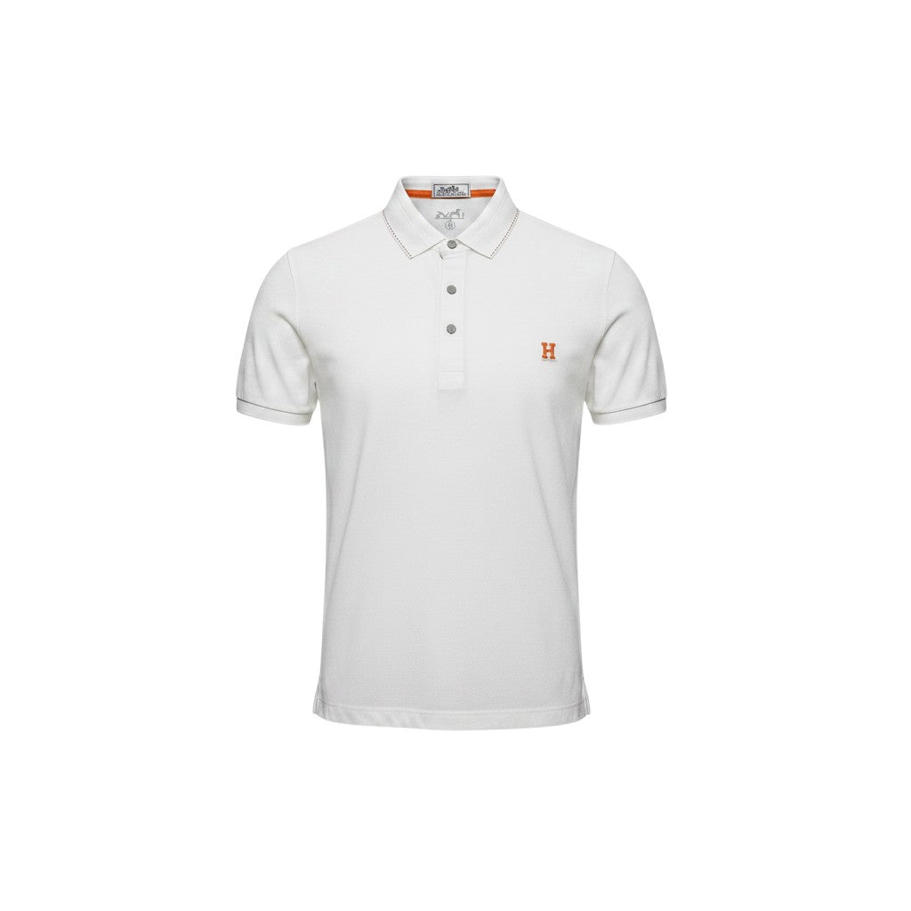 MASTERPIECE Hermès white textured polo shirt with orange embroidered H logo and contrast stitching on collar and cuffs.