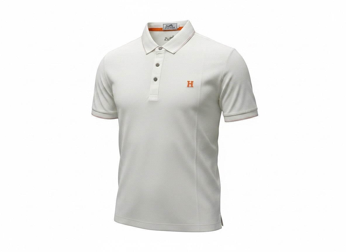 MASTERPIECE white textured polo shirt with orange embroidered H logo and contrast stitching on collar and cuffs.