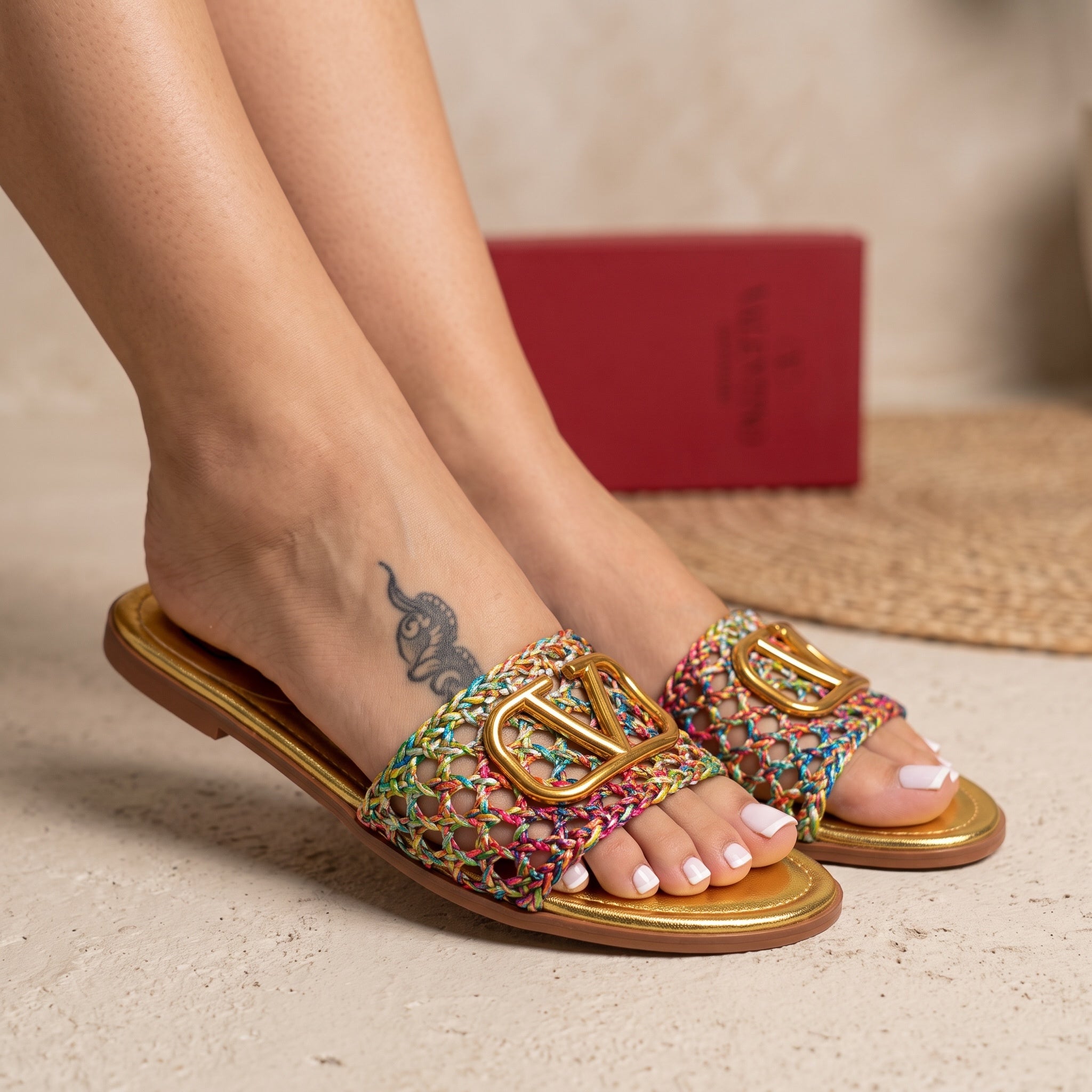 Valentino multicolor braided slides with gold V logo on gold footbed