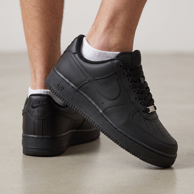 all-black Nike Air Force 1 low-top sneaker with tonal Swoosh and AIR midsole