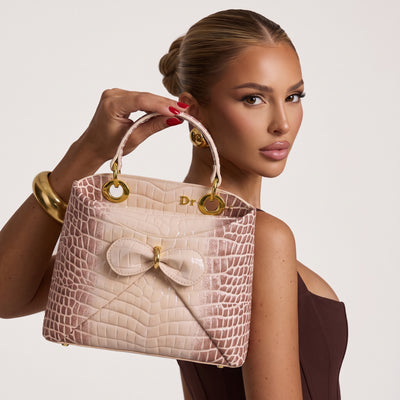Dior Lady top-handle bag in nude croc-embossed finish with bow and gold rings