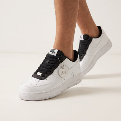 Nike Air Force 1 Low white sneaker with black tongue and AF1 charm
