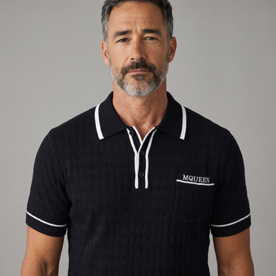 Black Alexander McQueen short-sleeve knit polo with white trim and chest MQUEEN embroidery