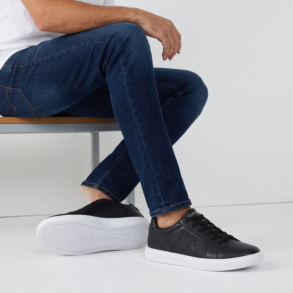 Calvin Klein black low-top sneakers with white sole and CK logo