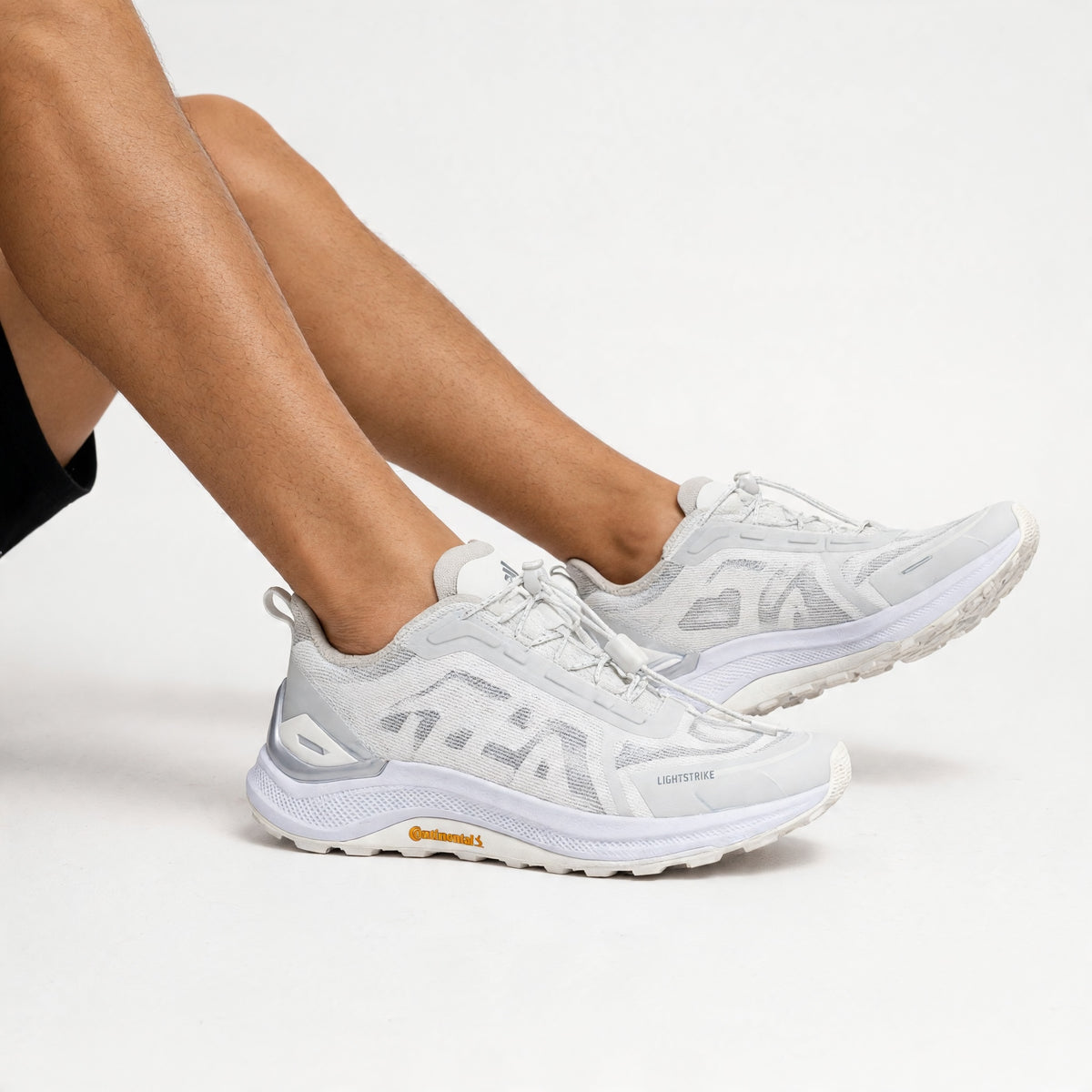 white adidas running sneakers with Lightstrike Pro midsole and Continental outsole