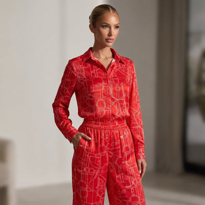Red long-sleeve button-up shirt with white equestrian line print