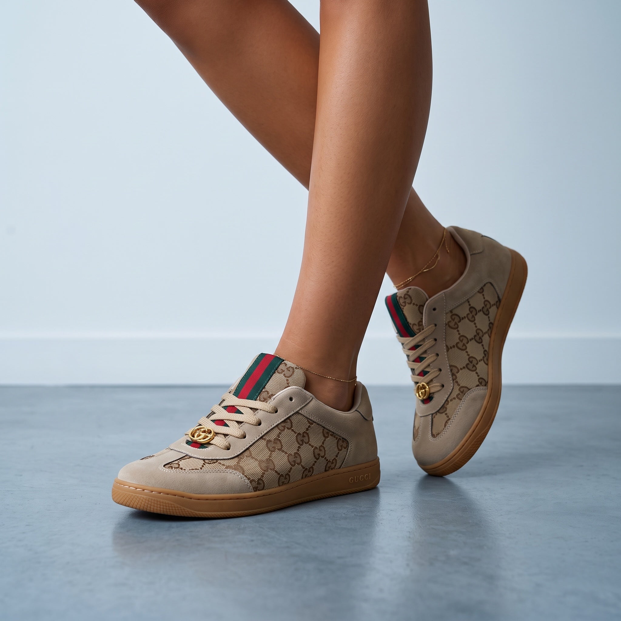 Beige Gucci low-top sneakers with GG monogram and green-red web stripe