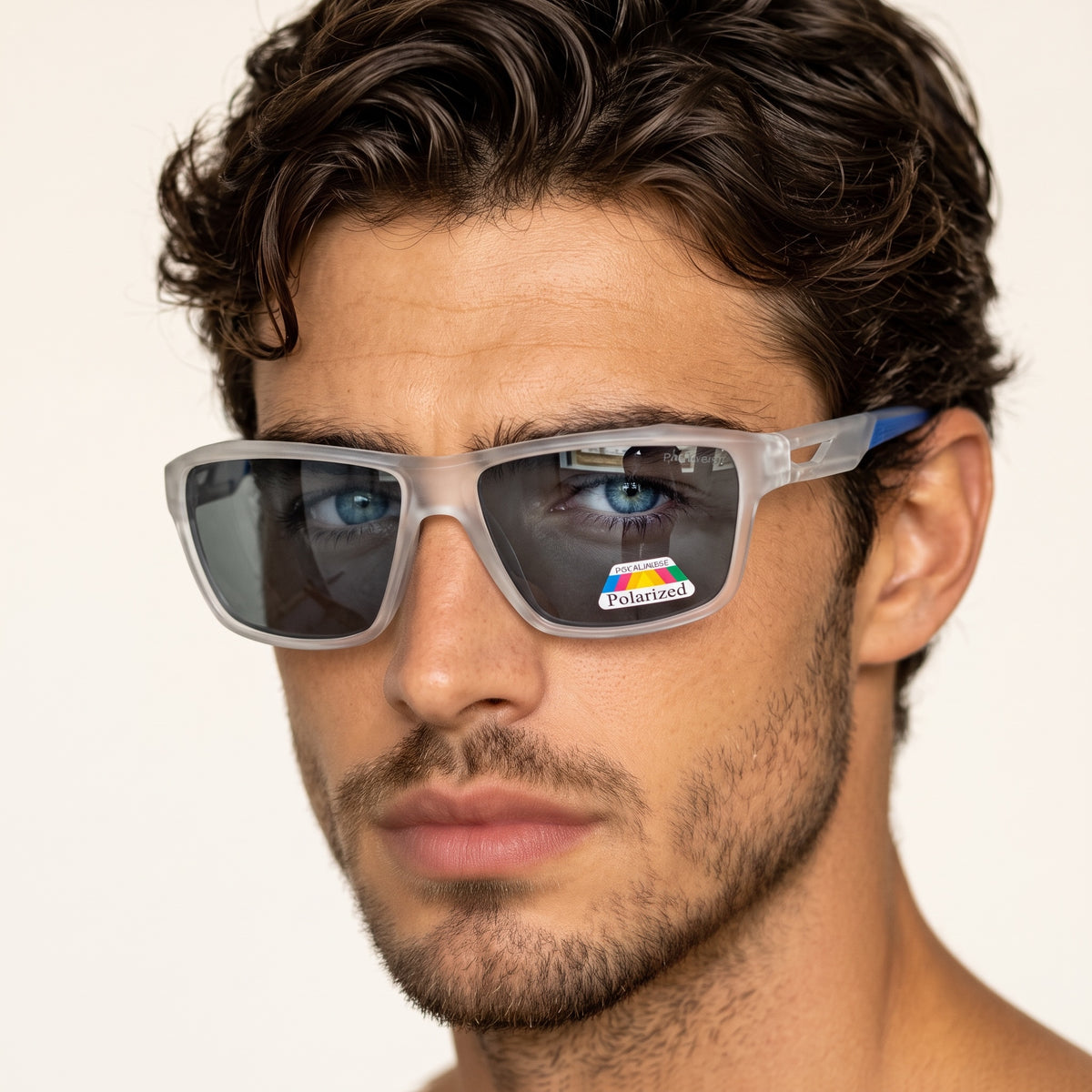 Close-up of man wearing frosted translucent grey rectangular polarized sunglasses