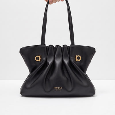 Black Ferragamo gathered tote with gold Gancini hardware and double top handles