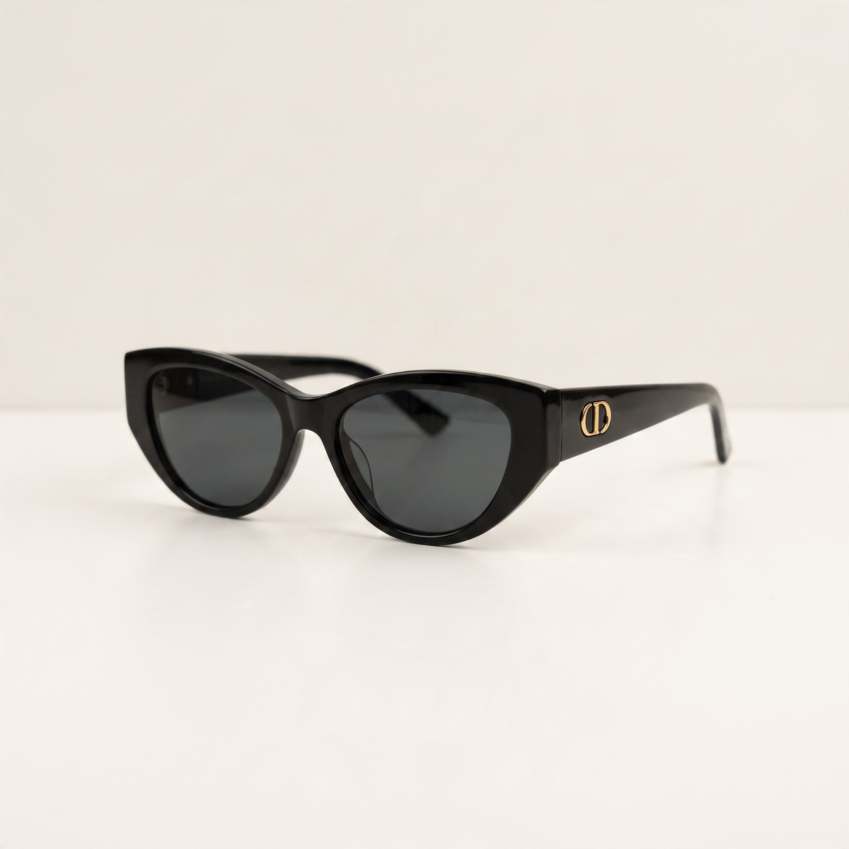 Black Dior cat-eye sunglasses with gold CD logo on temple