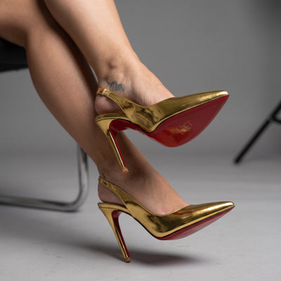 gold Christian Louboutin slingback high heels with red sole