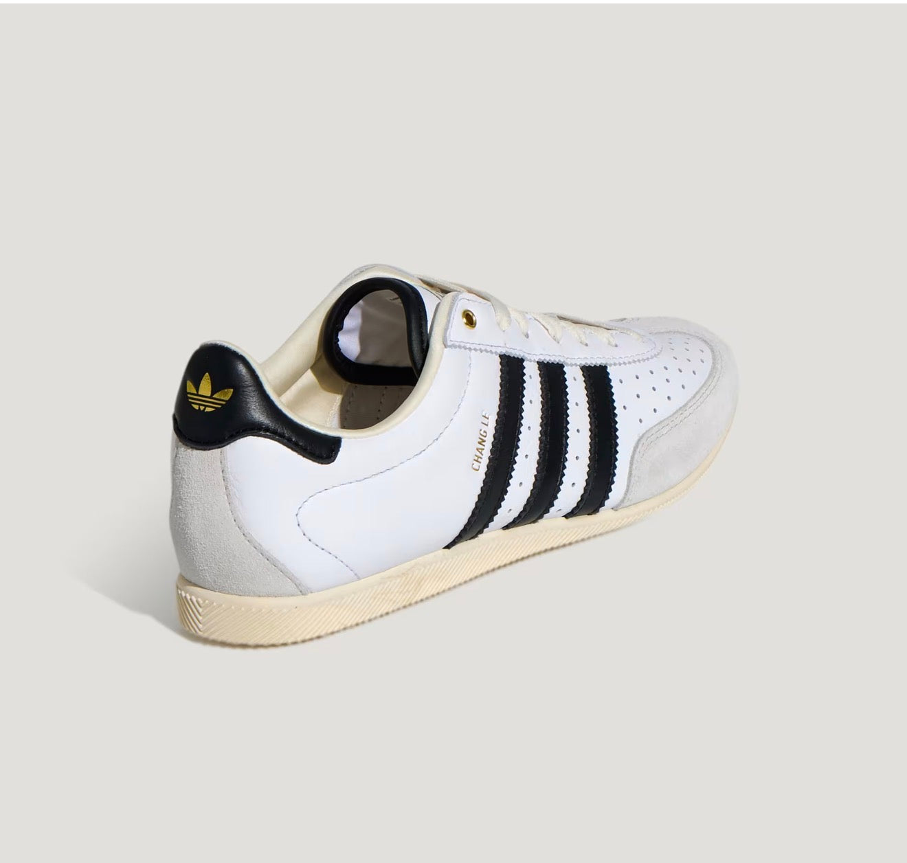 Adidas Chang Le white trainer with black stripes and pale grey suede toe
