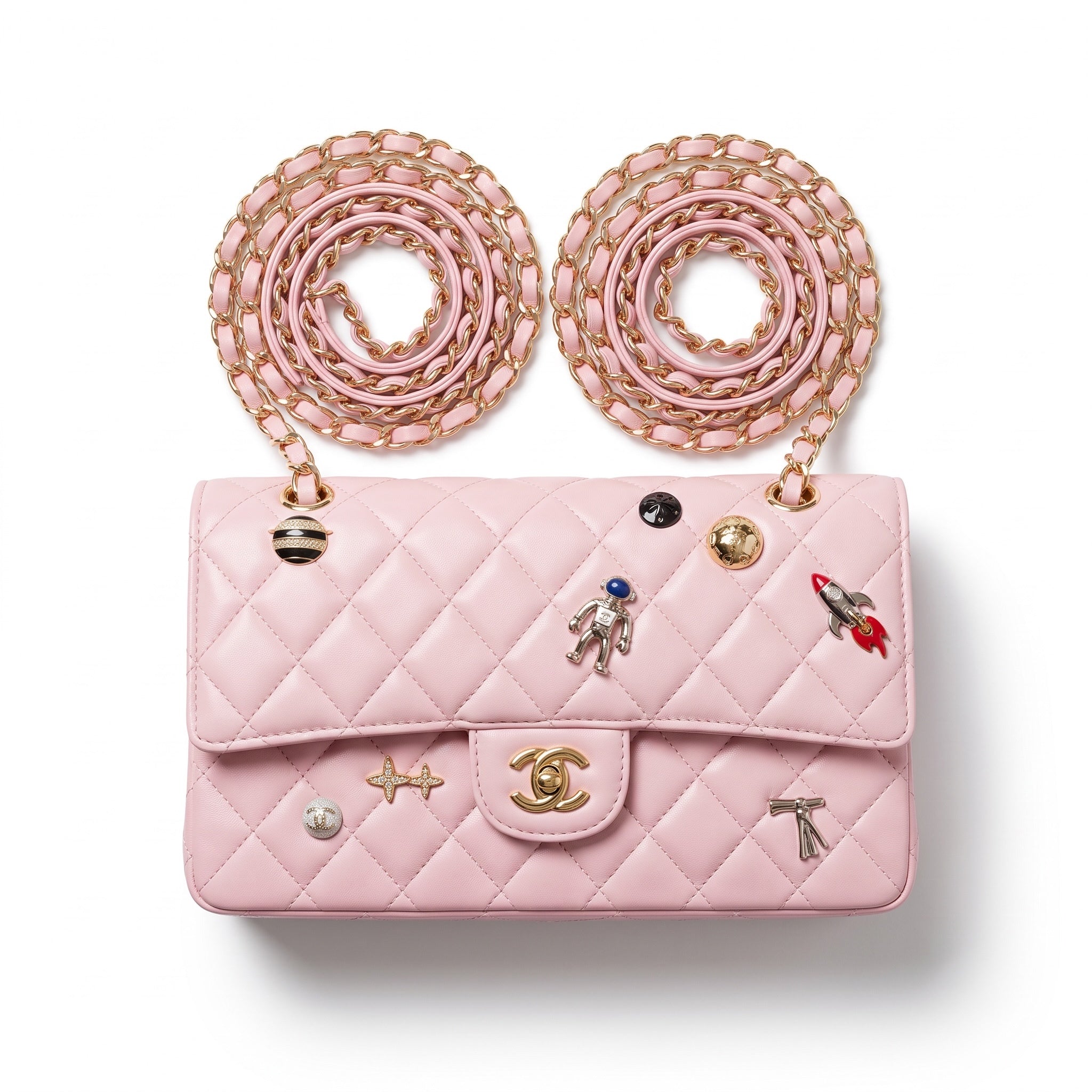 pink quilted Chanel flap bag with gold chain straps and charm pins