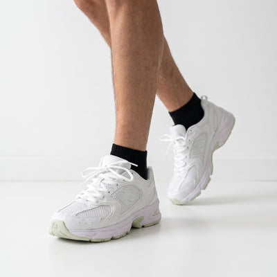 White New Balance chunky sneakers with mesh panels and visible N logo