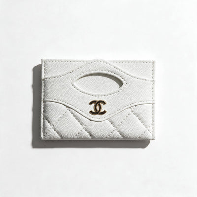 white quilted Chanel card holder with gold CC logo and multiple card slots