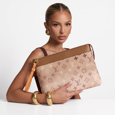Louis Vuitton beige monogram zipper pouch with tan trim and wrist strap