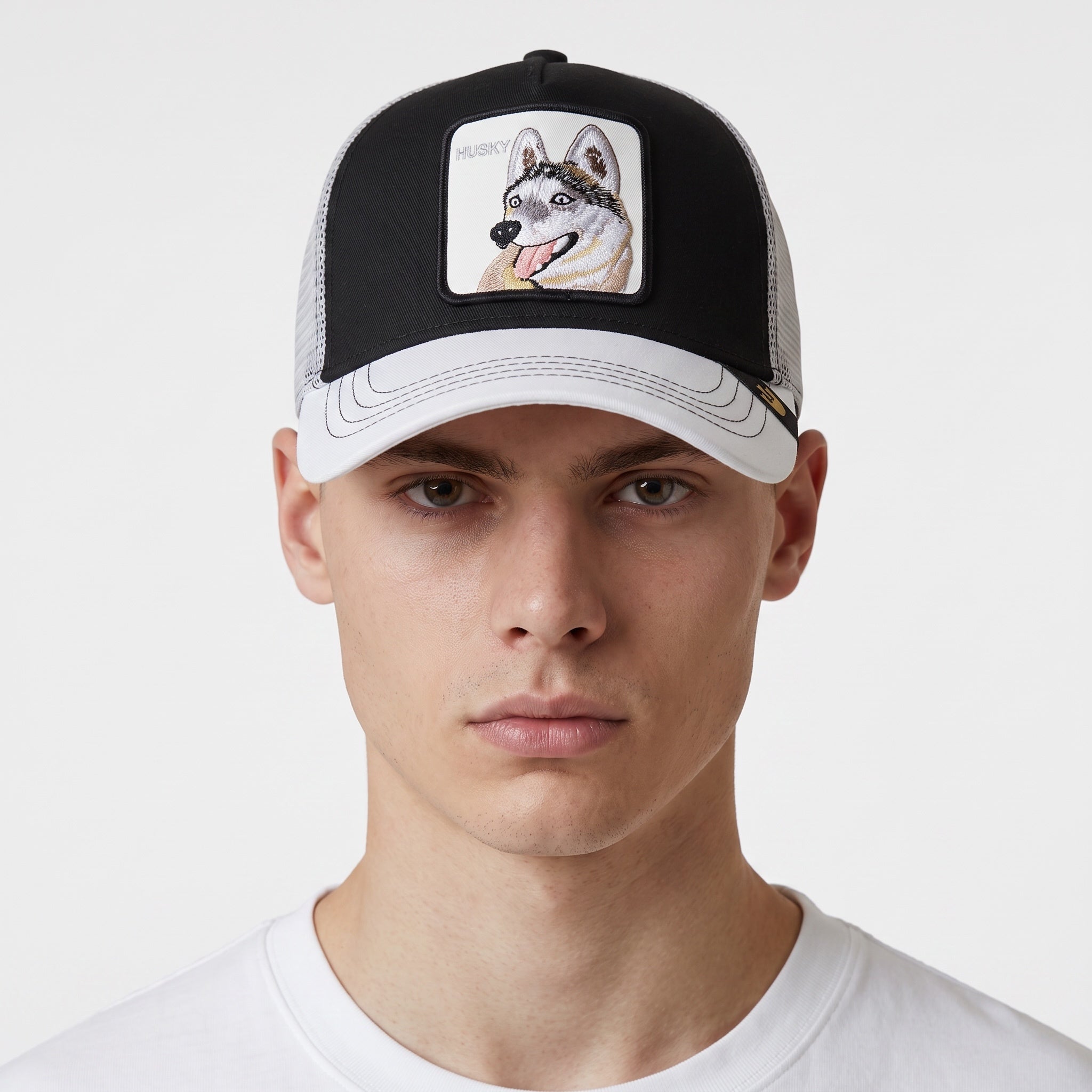 Black and white trucker cap with embroidered husky patch on the front