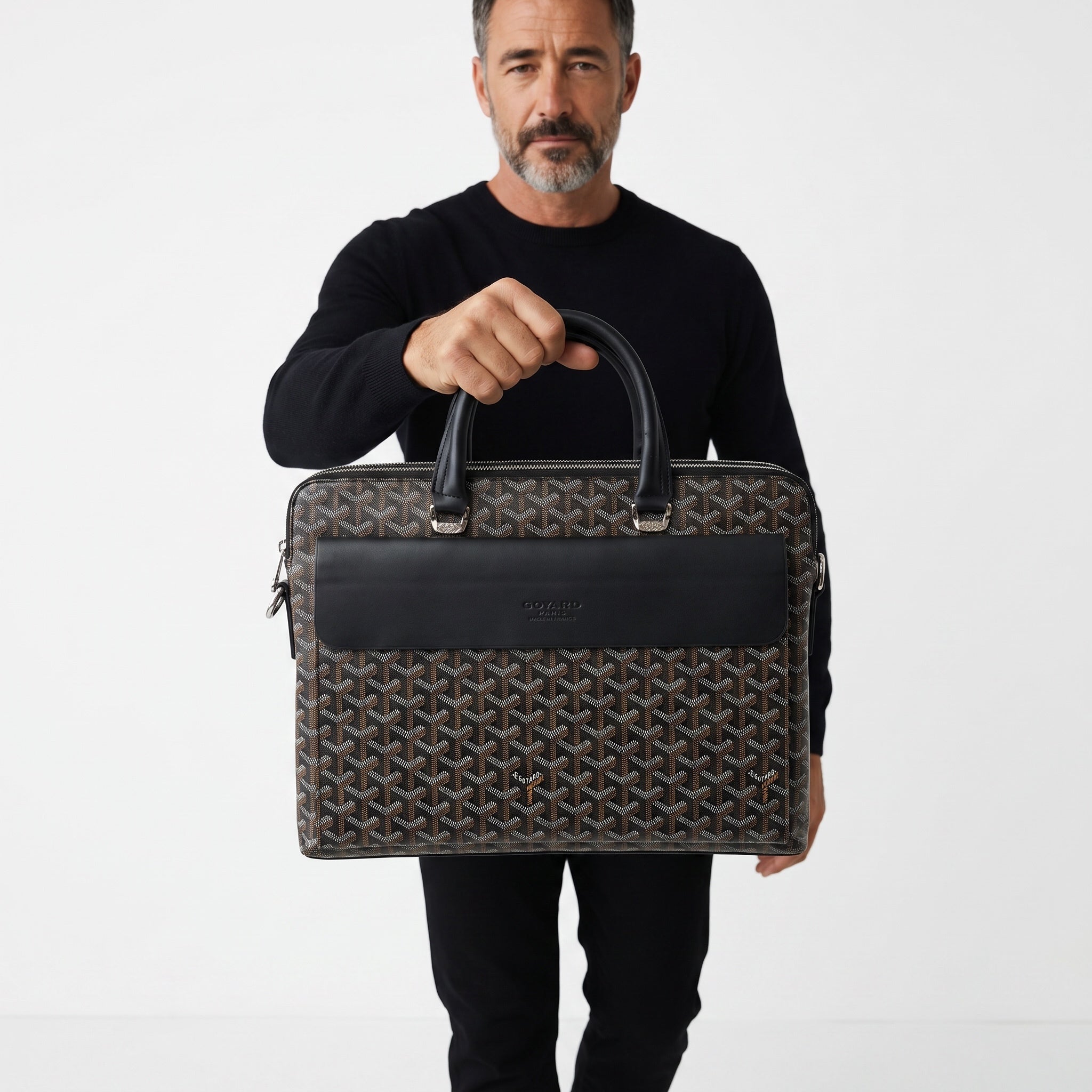 Goyard brown patterned briefcase with black leather front pocket and top handles