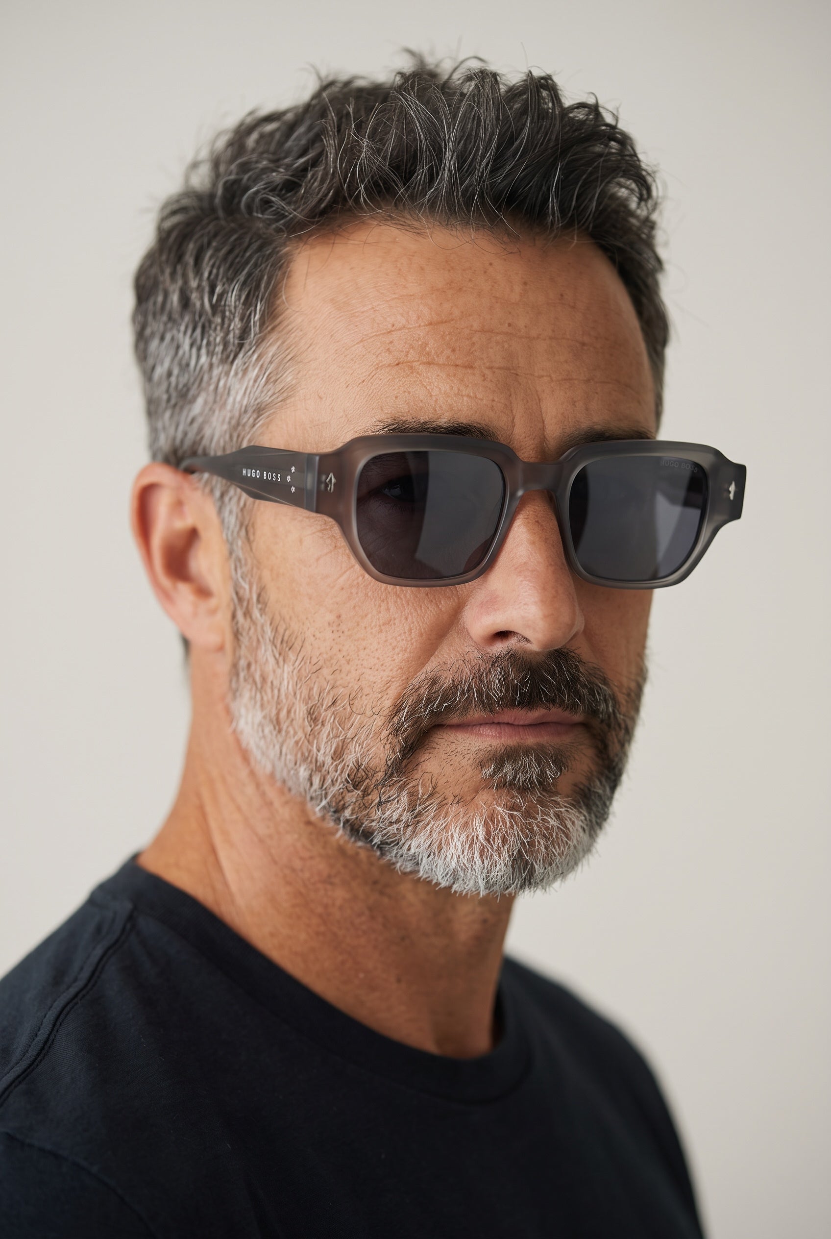 Hugo Boss matte grey square sunglasses with dark lenses on male model