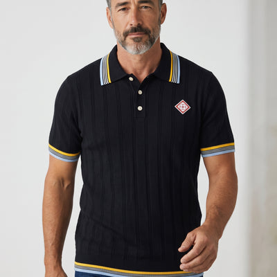 men's navy ribbed polo with striped collar and embroidered chest patch